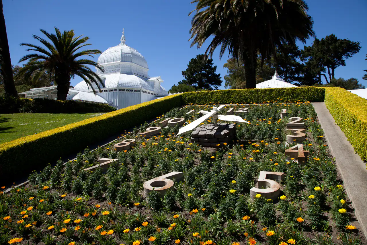 Colorful patterned flower beds on the lawn in front of the Conservatory of Flowers