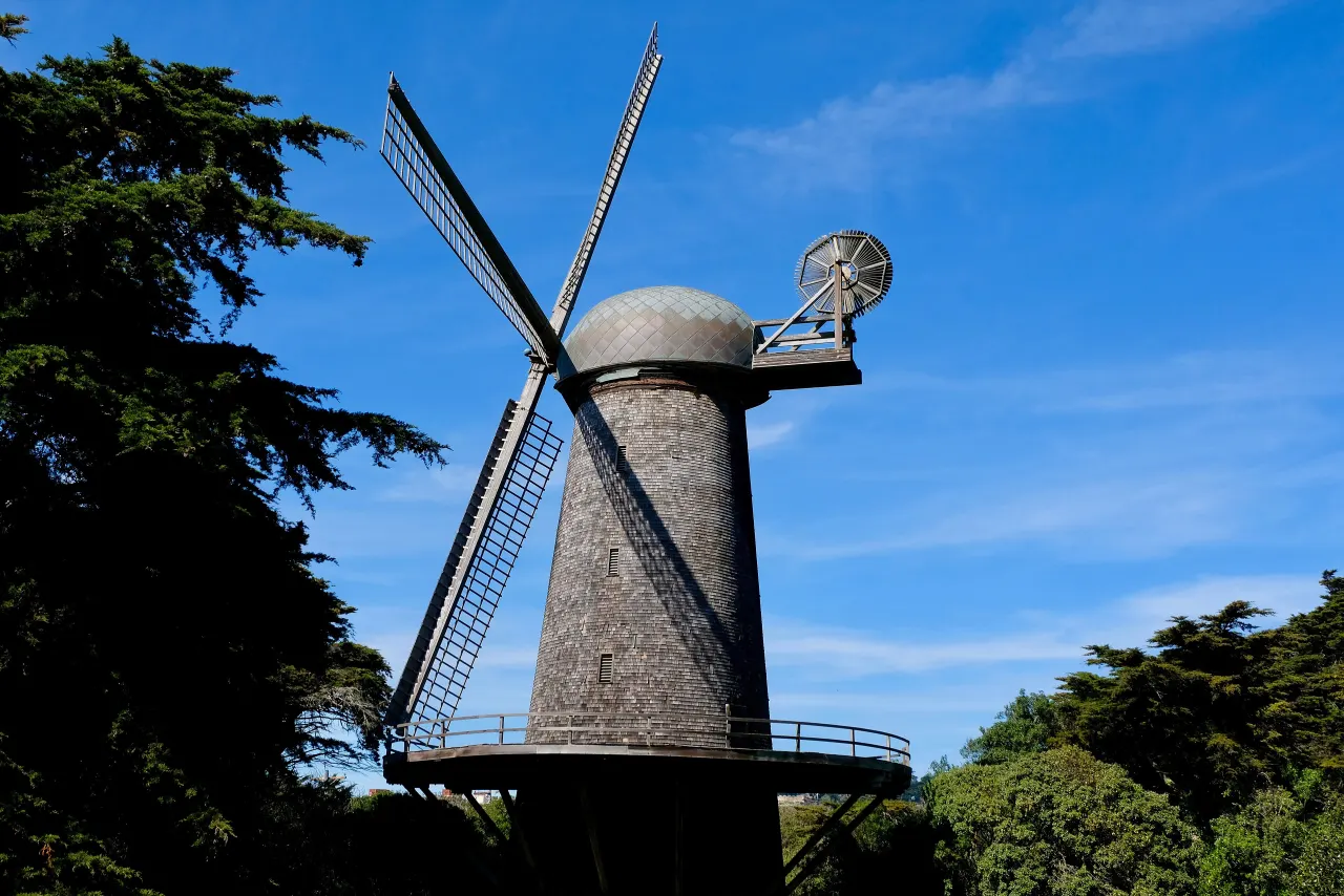 The Dutch Windmill with its sails against a deep blue sky