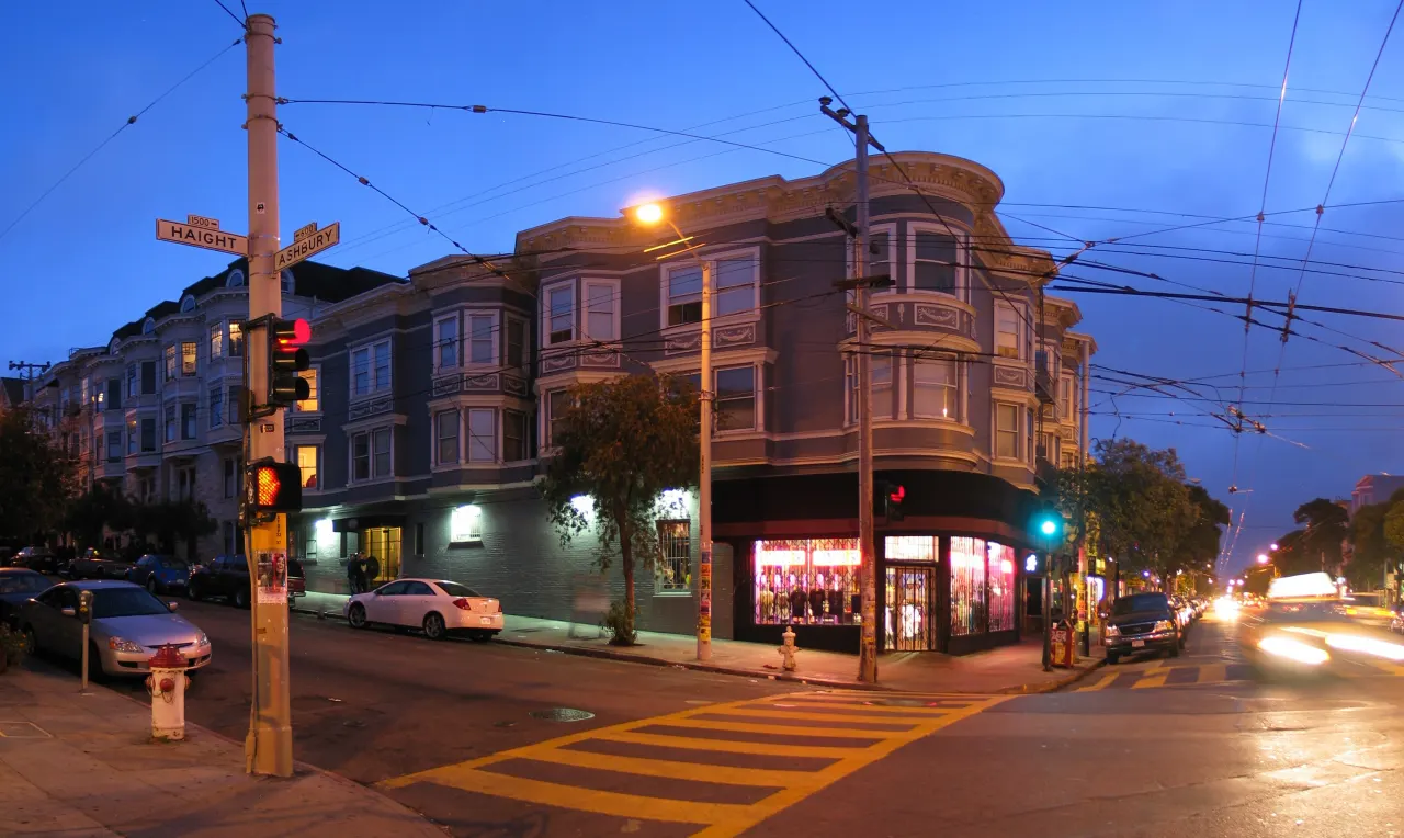 Shops and street lights at the corner of Haight and Ashbury streets at dusk