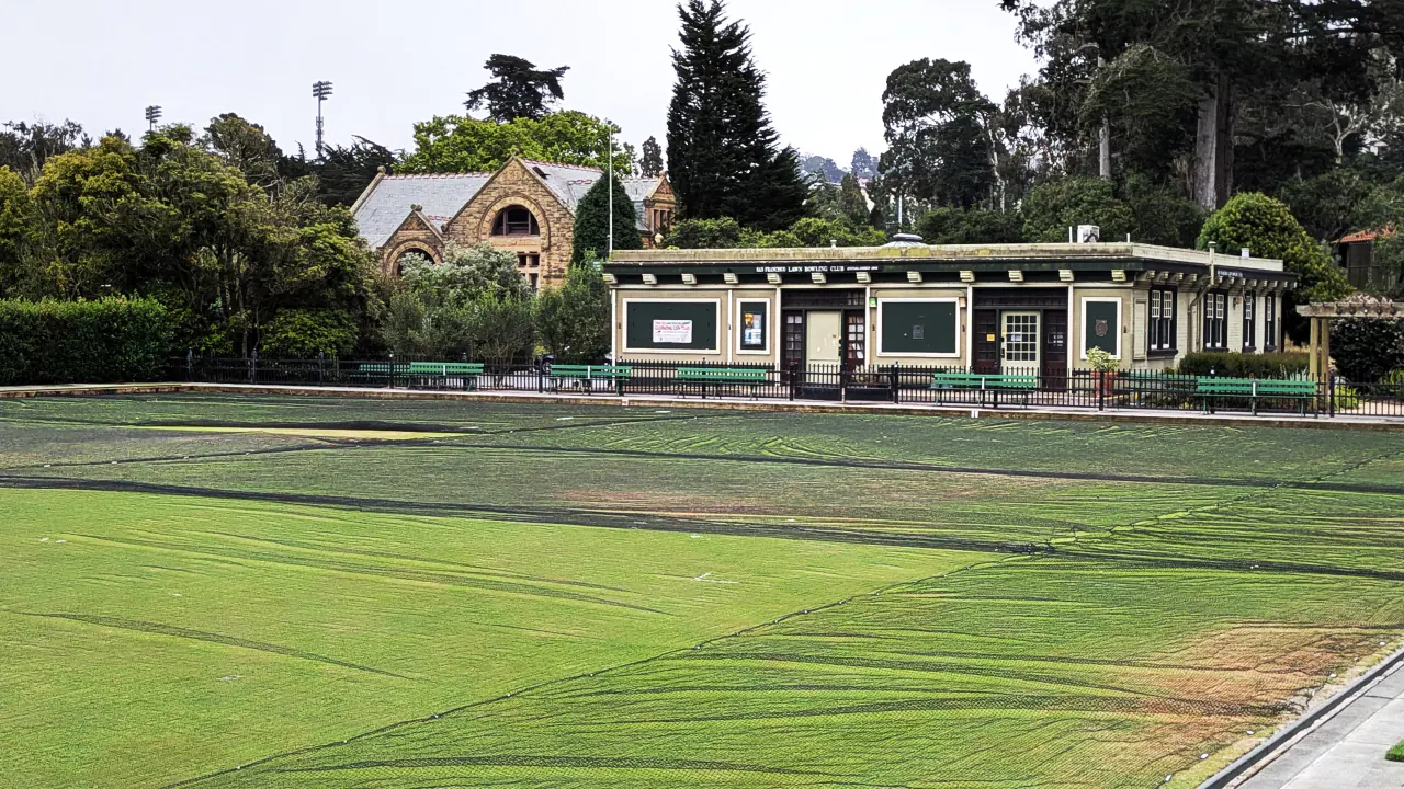 The clubhouse and level greens of the San Francisco Lawn Bowling Club